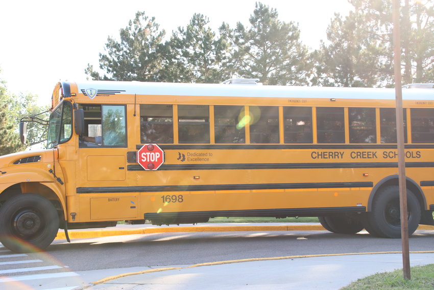 A bus pulls out of Smoky Hill High School's parking lot on Aug. 18, 2020, the first day of school for freshmen.